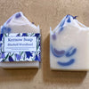 Kernow Soap Bluebell Woodland soap bar with packaging on a beige background