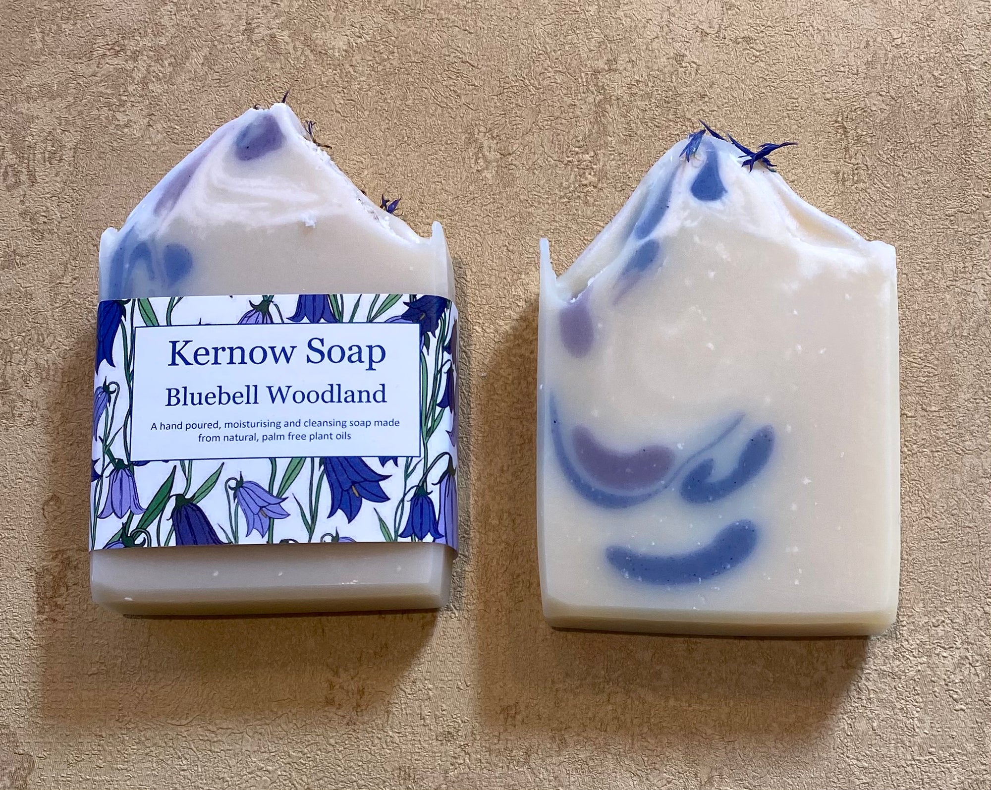 Kernow Soap Bluebell Woodland soap bar with packaging on a beige background
