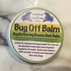 Bug Off Balm round container with label on a marble surface