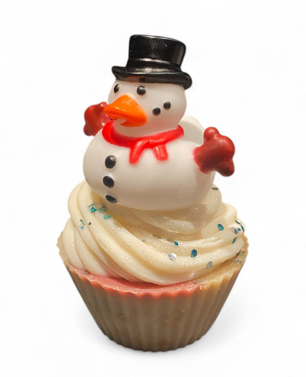 Cupcake with a duck snowman decoration on a white background