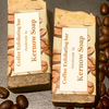 two labelled half bars of Kernow Soap Coffee exfoliating.