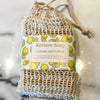 A bar of lemon litsea soap in a sisal bag.