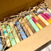 Set of colourful soap ends in a cardboard box with dried herbs and lavender