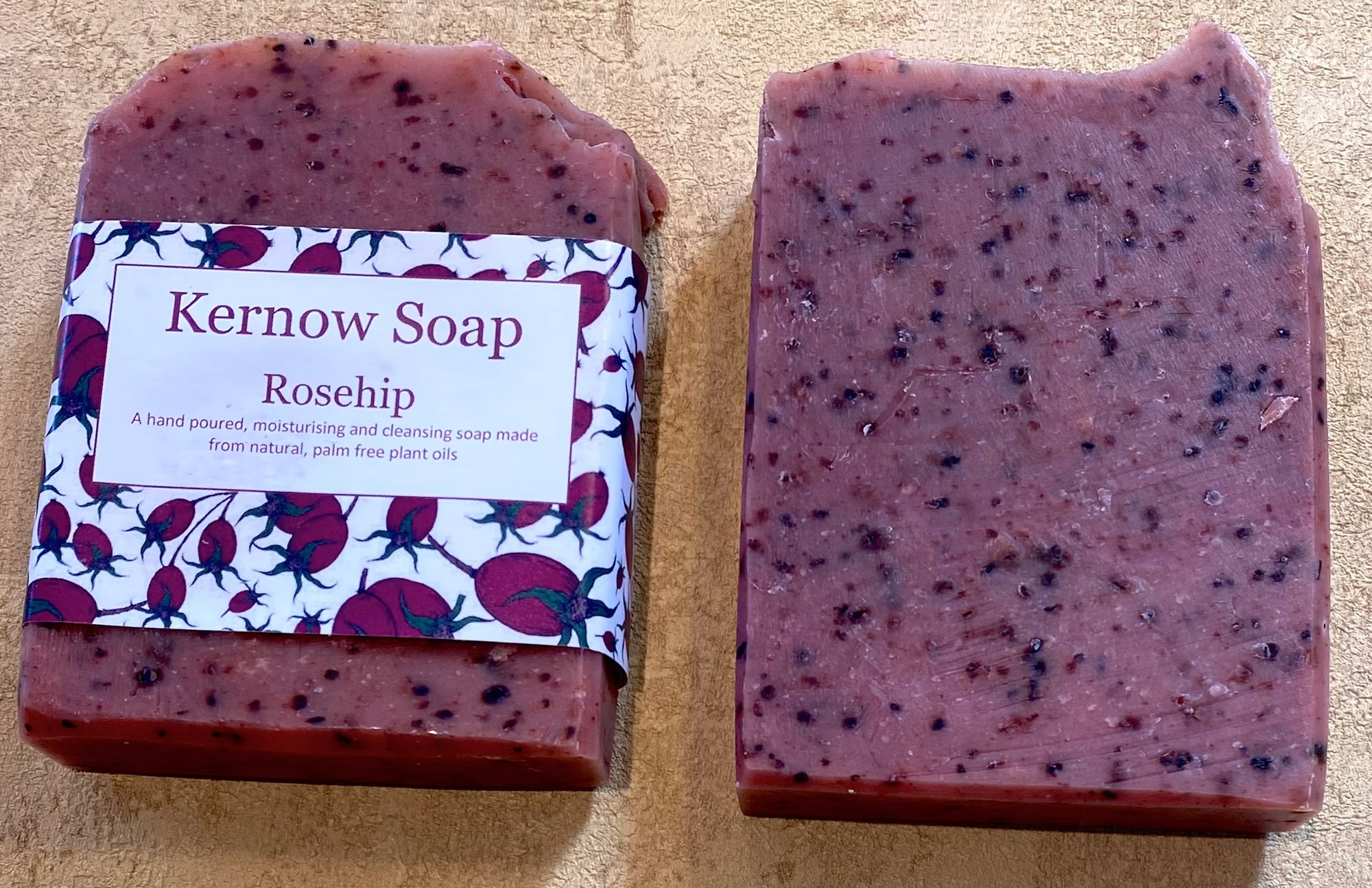 Two bars of Kernow Soap on a beige surface